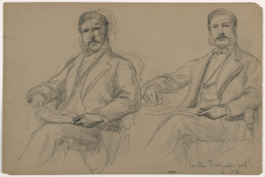 Zwei Männer in Anzügen sitzen nebeneinander auf Stühlen mit ernsten Gesichtern und schauen auf ein Papier mit teilweise sichtbarem Text.