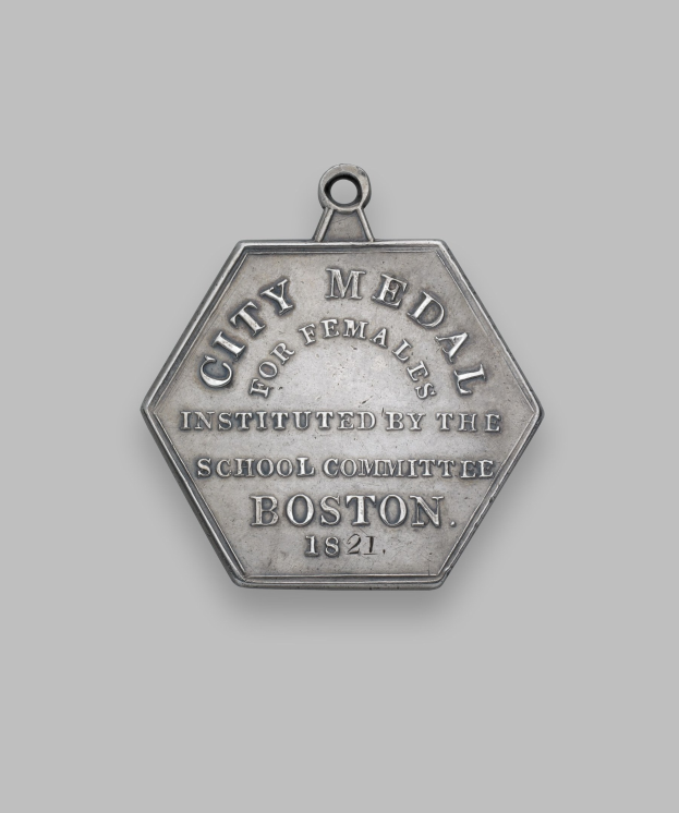 Silberne Medaille mit der Aufschrift 'Stadtmedaille für Frauen' auf weißem Hintergrund.